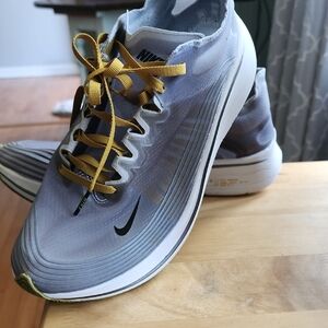 Nike Gray and Yellow Athletic Shoes with Modern Silhouette